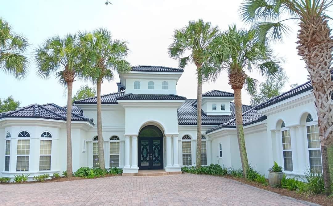White Mediterranean estate with palm trees